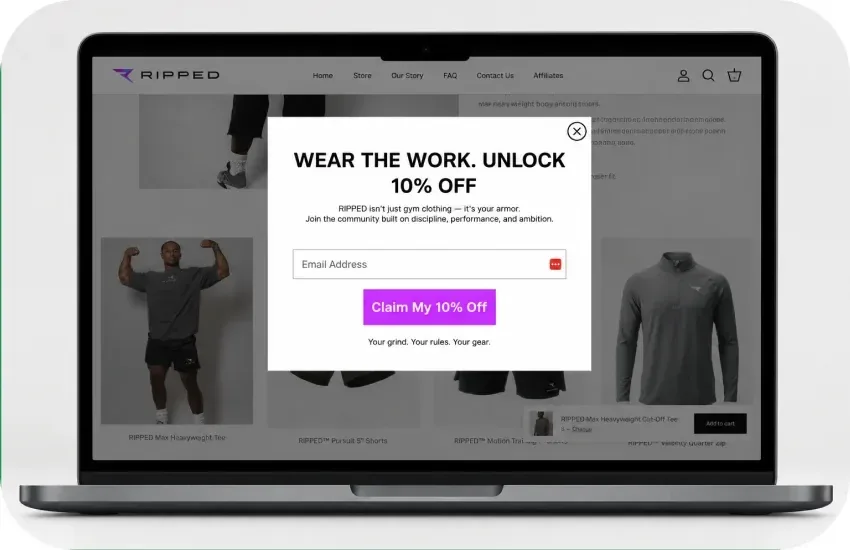 The RIPPED email sign-up offer, “Wear the work. Unlock 10% off”, on a laptop