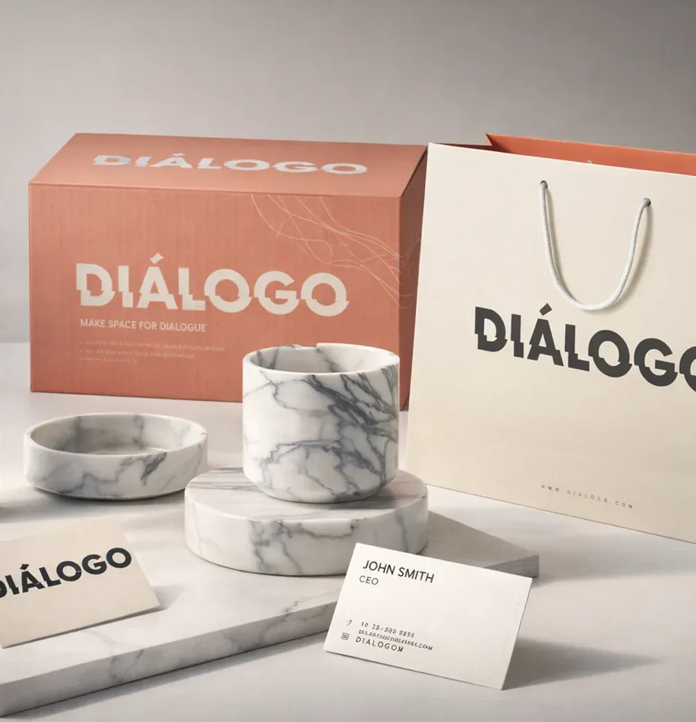 Dialogo packaging: a terracotta box, a paper bag and marble bowls